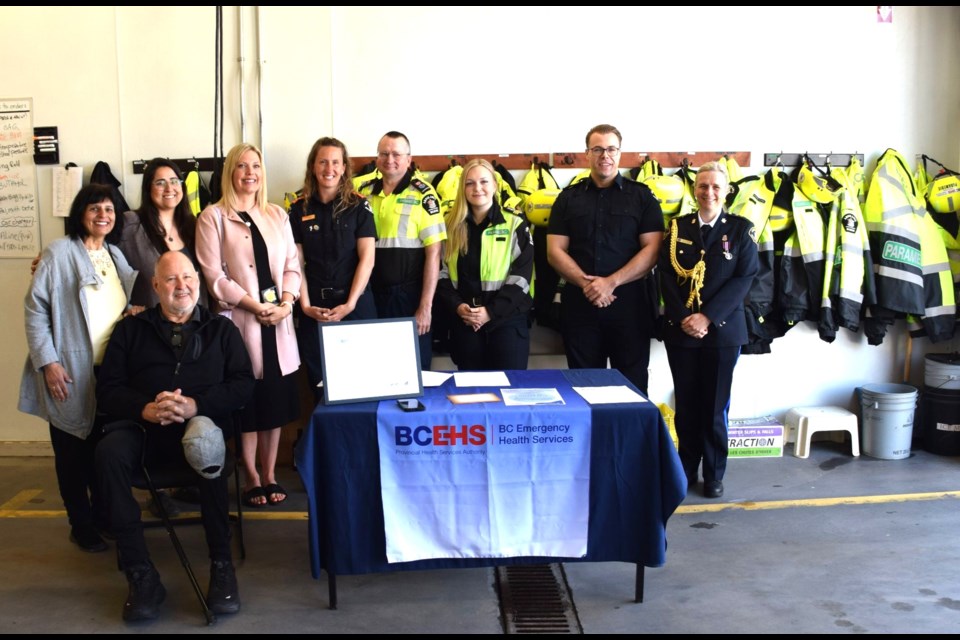 From left to right, Ed Ed Kaczmarek  (seated), wife Rina, daughter Angelique Yuen, nurse Aili Dawson, and primary care paramedics Annelie Van Der Heyden, Bart Nikodem, Aly Fors, and Benjamin Blades.